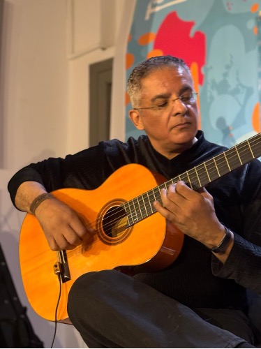 Wael Khedr playing a flamenco guitar — flamenco guitar buying guide